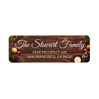 Christmas return address label with text on photo of rustic wood, pinecones