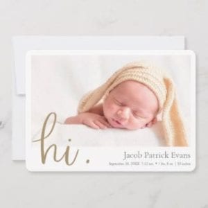 simple modern horizontal photo birth announcement card for a boy or girl with white borders and hi in gold script