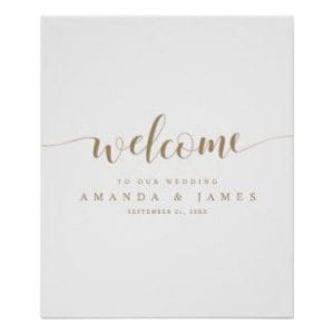 simple modern minimalist wedding welcome sign with text in gold and a whimsical script on a white base