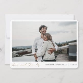 simple modern horizontal wedding thank you card with love and thanks in gold script below photo