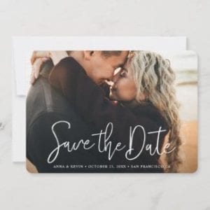 horizpntal wedding save the date card with full photo and modern white script