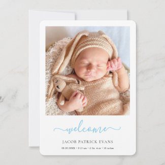 simple modern baby boy announcement card with photo and blue script.