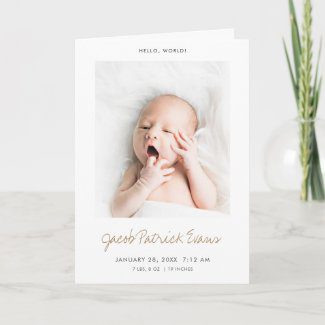 Birth announcement note card with photo and modern typography.
