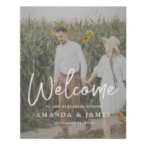 Photo rehearsal dinner welcome sign with modern white typography.