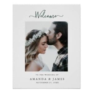 Simple modern photo winter wedding welcome sign with evergreen text and a white border